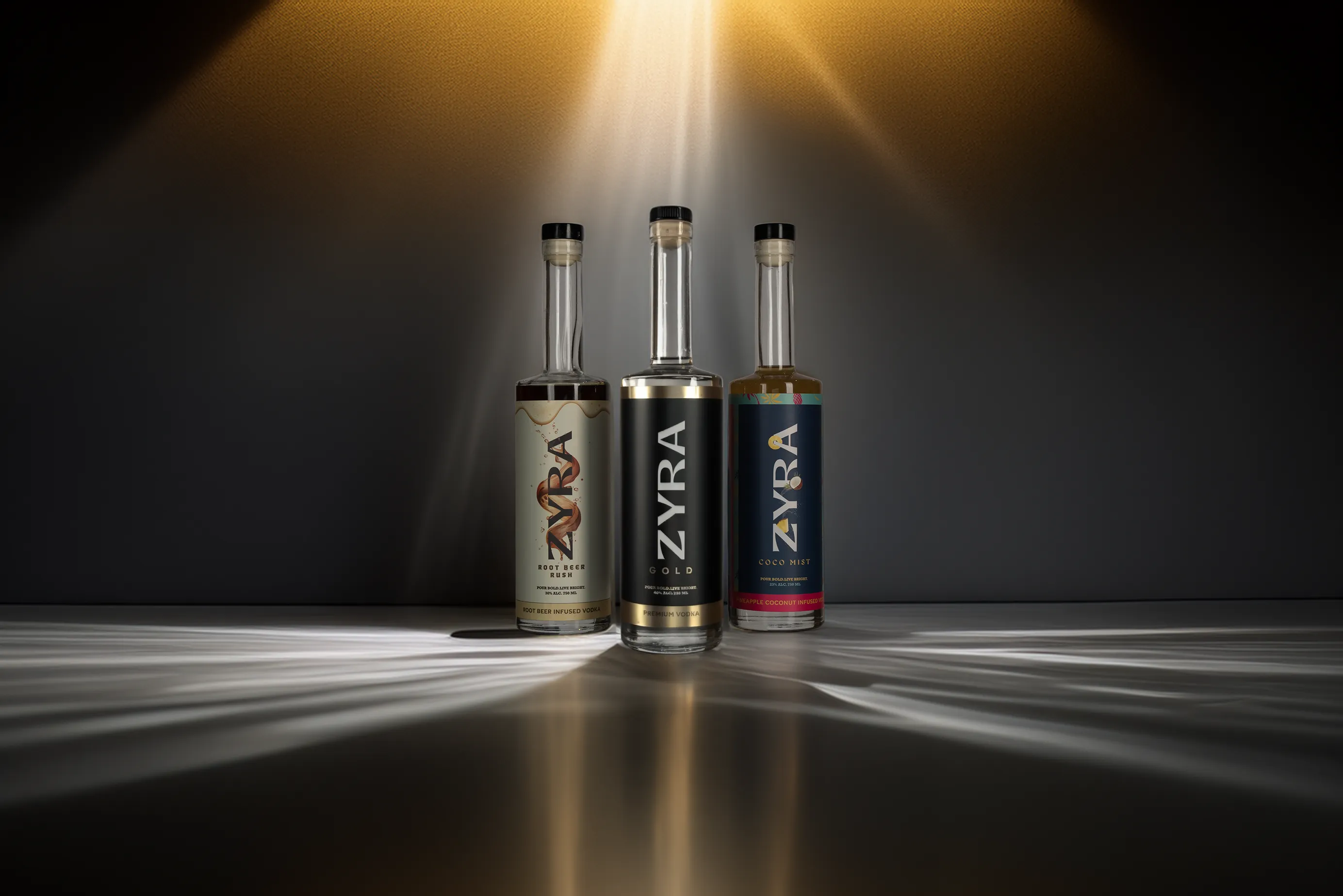 The Zyra Vodka lineup: Gold, Coco Mist and Root Beer Rush bottles side by side